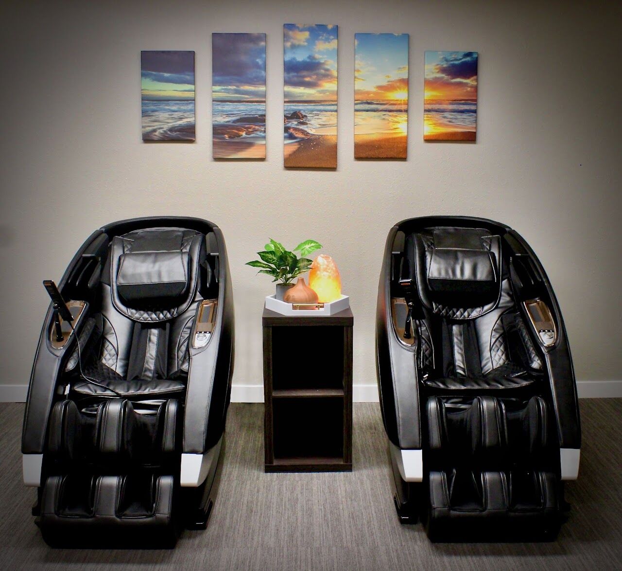 Two zero gravity massage chairs side by side